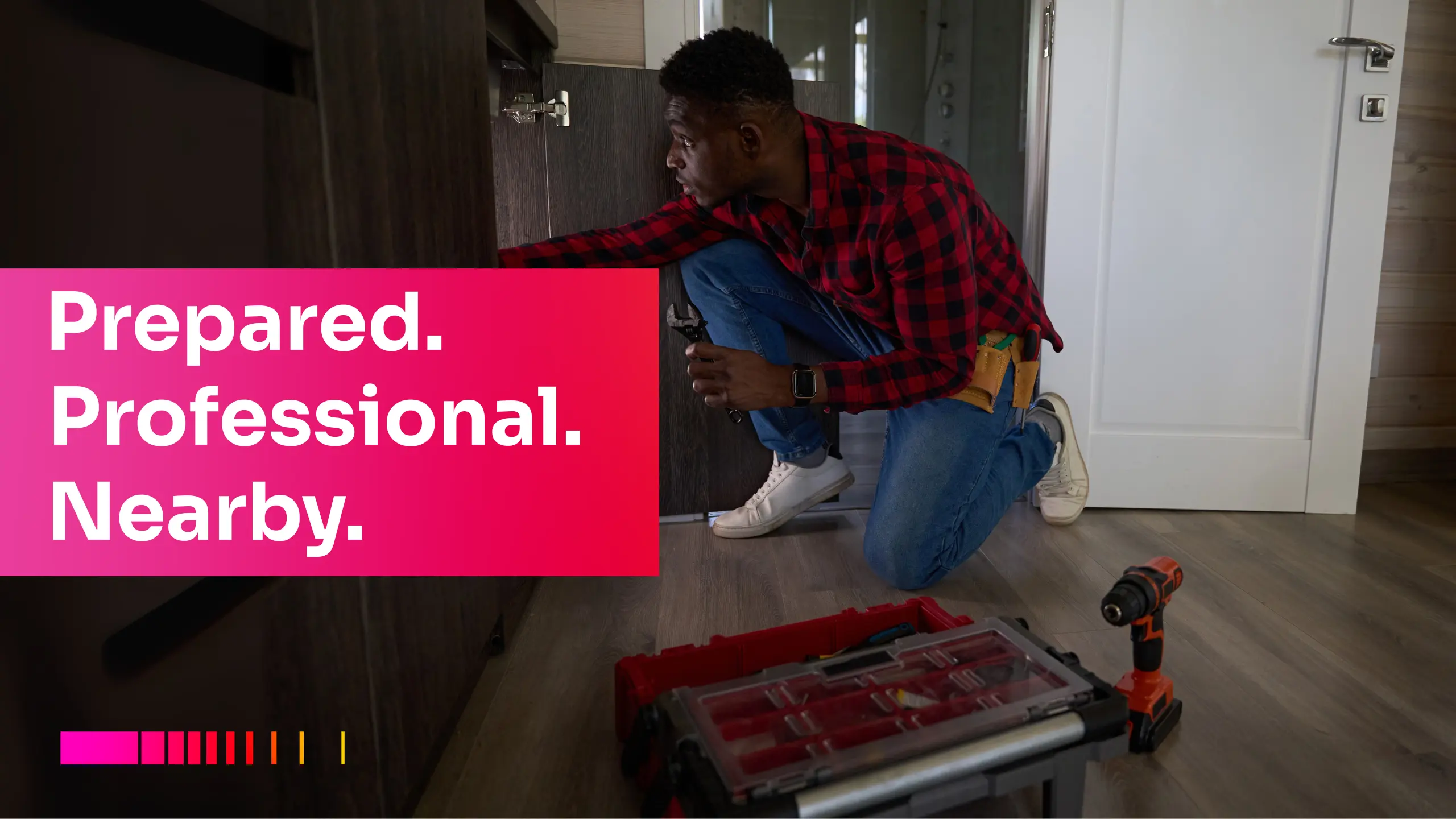 Local plumber fixing kitchen cabinet with tools. plumber near me services